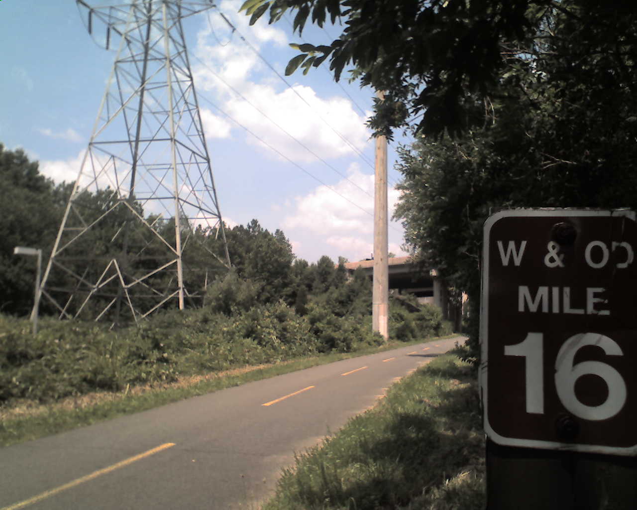 Paved rail-trail with mile marker on a Virginia multi-use path